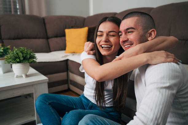 istock Young couple watching basketball game on television. 2088204530