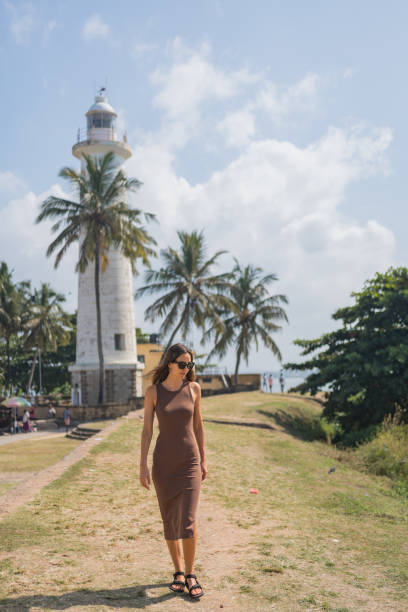istock Young woman explores headland 2088219088