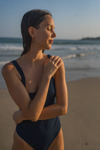 istock Young woman enjoys beach 2088239654