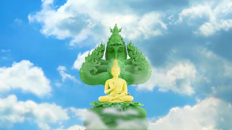 gold buddha protected by the hood of the green mythical king naga with blue sky white cloud time lapse