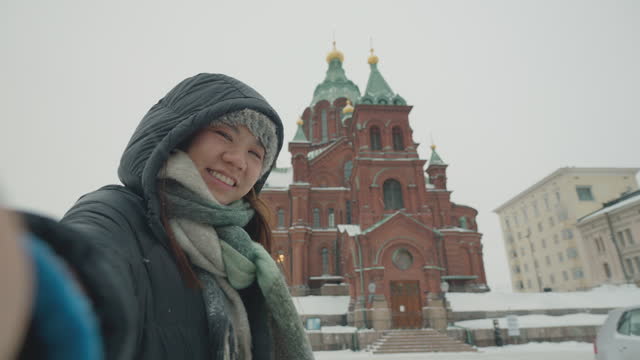 Tourists Travel To Uspensky Cathedral In Helsinki, Finland