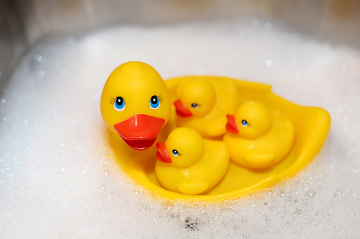 plastic ducks in bubble bath