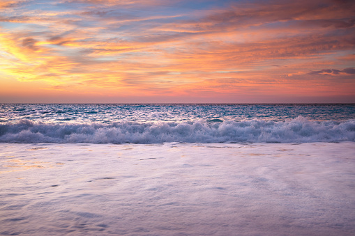 Waves On Famous Myrtos beach in Kefalonia island at sunset.