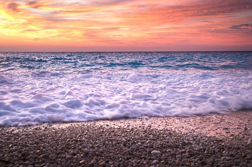 Waves On Famous Myrtos beach in Kefalonia island at sunset.