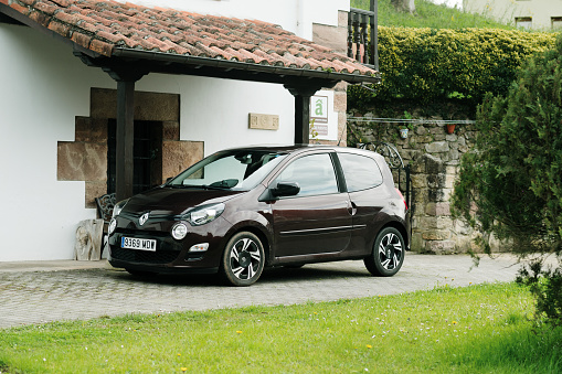 Puente Viesgo, Spain - 9 March 2024: A Renault Twingo stationary by a house
