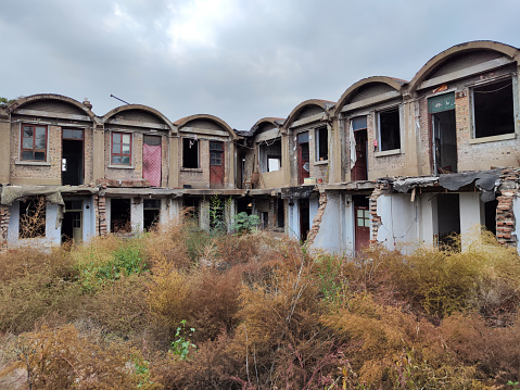 Old abandoned gothic house. The ruined mansion stands in the park. Gothic background. Halloween party place