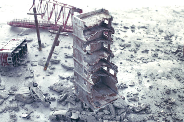 A diorama of a city destroyed by disaster or war and people wandering around.