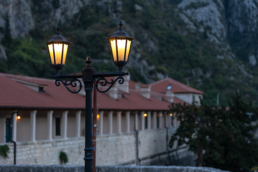Yellow light, illumination street lamp in the old town of Kotor, Montenegro