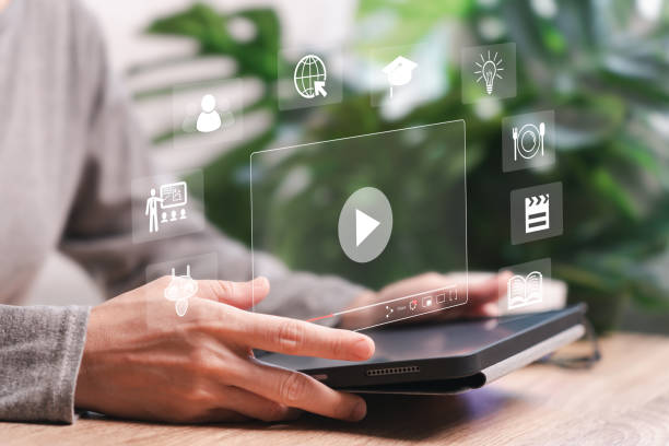 istock Video streaming on the Internet concept, Women use tablets to search Live digital stream multimedia for learning on video, new ideas, AI learning, Online books, Learning information about business 2088397982