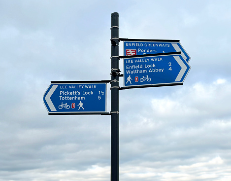 Walking and cycle route signs to Waltham Abbey, Picketts Lock, Enfield lock and Tottenham on the River Lee Navigation in the Lee Valley Regional Park