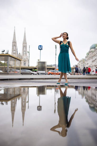 Fashionable young woman standing on the street in downtown Vienna.