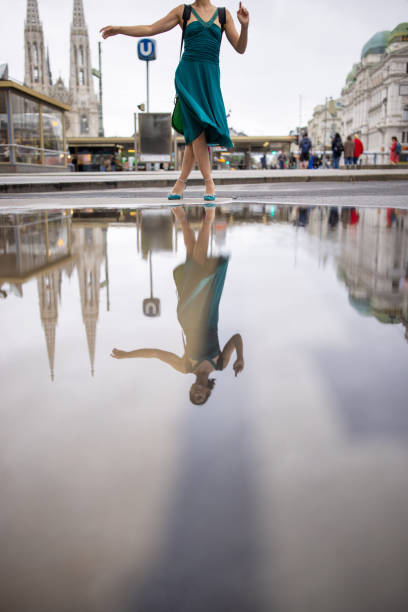 Fashionable young woman standing on the street in downtown Vienna.