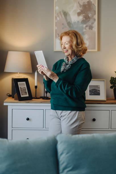 istock Senior woman using digital tablet at home 2088483399