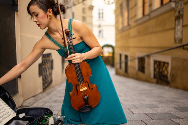violinist finished playing for today - vienna street musician music musician photos et images de collection