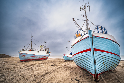 Thorup beach with active fishing vessels cutters, in Thy, Denmark