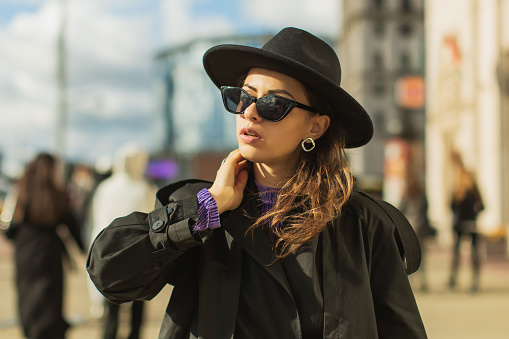 Woman in black coat. Street style
