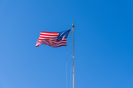 Flag on Liberty island, New York.  It has a smaller number of stars on it.