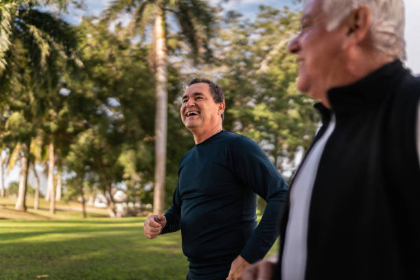 istock Senior friends talking and run at public park 2088544750