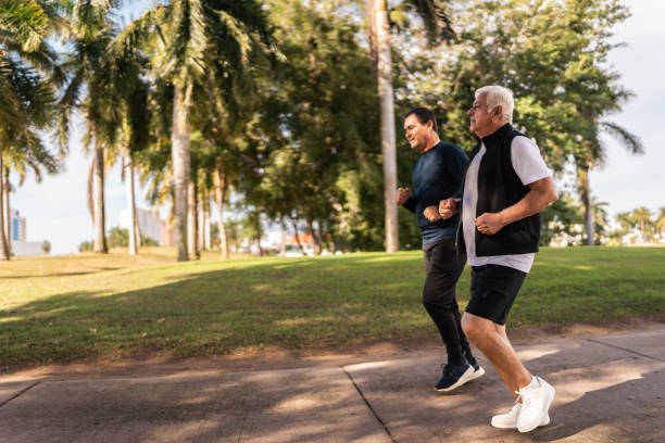 istock Senior friends talking and run at public park 2088545804