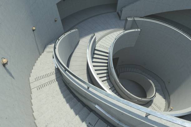 istock 3D illustration of a Brutalist architectural design. A spiraling staircase, surrounded by textured concrete walls, is dramatically lit, creating a play of shadows. 2088546321