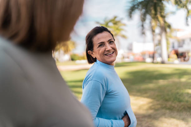 istock Senior women running and talking at public park 2088558752