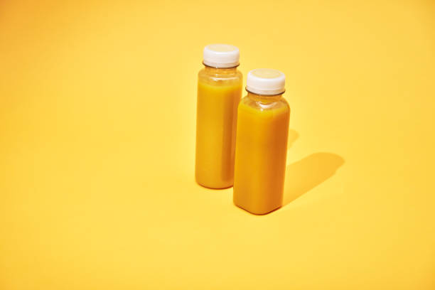 istock Variation of Smoothies in Recycled PET Plastic Bottles on Yellow Background 2088655236