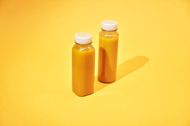 istock Variation of Smoothies in Recycled PET Plastic Bottles on Yellow Background 2088655346