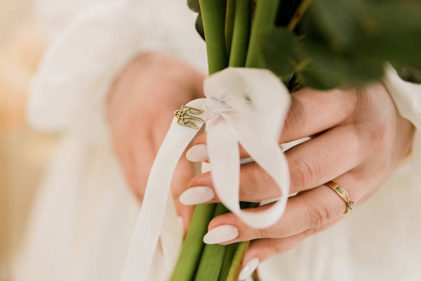 istock the bride holds a wedding bouquet in her hands with a groom 2088656395