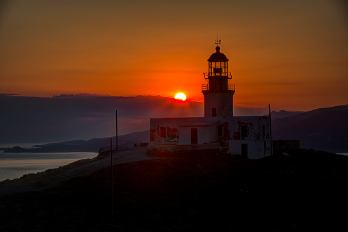 The beautiful Lighthouse of Armenistis at sunset in Mykonos island, Greece
