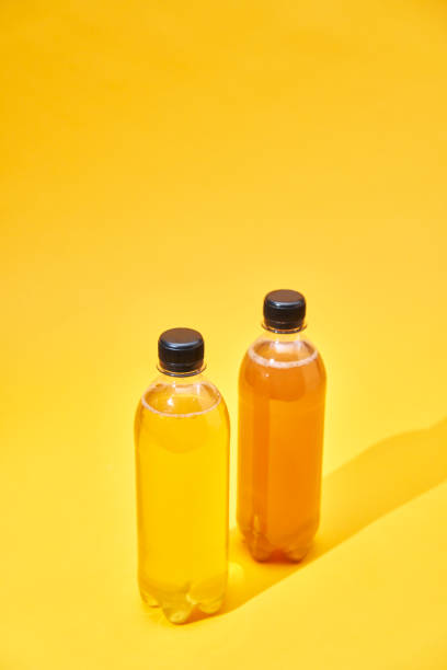 istock Iced Tea in Recycled PET Plastic Bottles on Yellow Background 2088671018