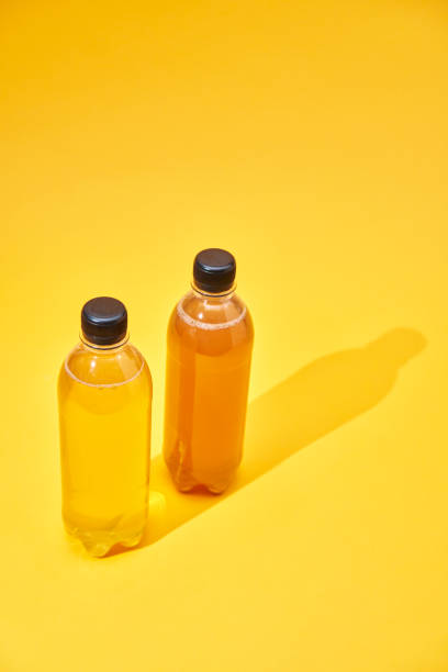 istock Iced Tea in Recycled PET Plastic Bottles on Yellow Background 2088683481