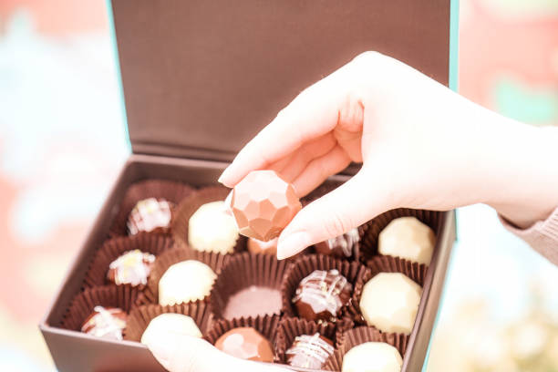 istock Person Holding Box of Chocolates 2088738367