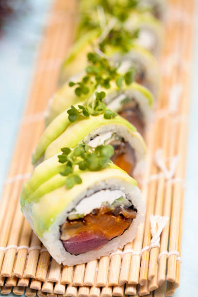 istock Close Up of Sushi Roll on Bamboo Mat 2088798304