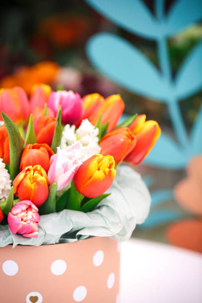 A vase filled with an abundance of vibrant, colorful flowers, offering a captivating display.