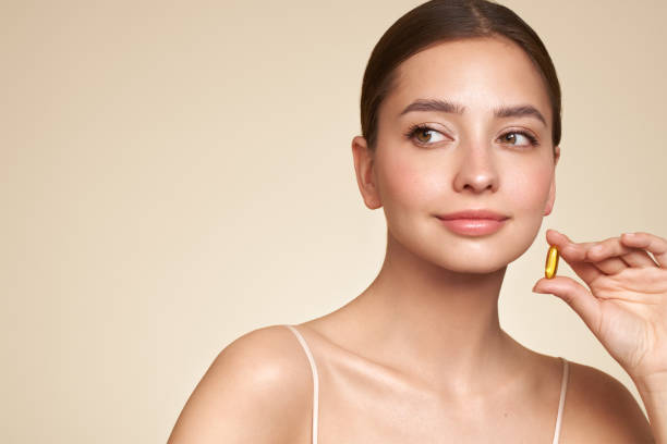 istock Beautiful Girl With Pill With Cod Liver Oil Omega-3 2088855183