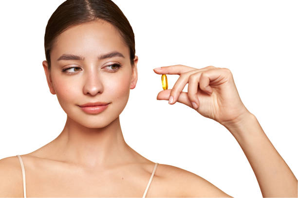 istock Beautiful Girl With Pill With Cod Liver Oil Omega-3 2088856729
