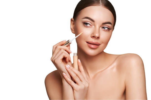 istock Portrait beautiful young woman with foundation bottle 2088858268