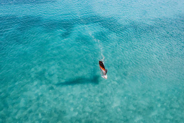istock People windsurfing on clear blue sea 2088871669