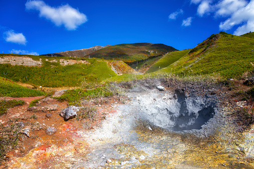 Craters with boiling volcanic mud. Iturup, Kuril Islands. Russia