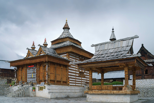 Hindu Mathi temple, important for Hindus, nestled under clouded sky high up in the Baspa valley of the Himalayas in the small town of Chitkul, Himachal Pradesh, India.