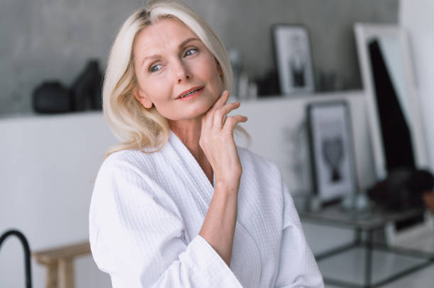 istock Woman touching her perfect smooth face,standing in bathroom 2088875881