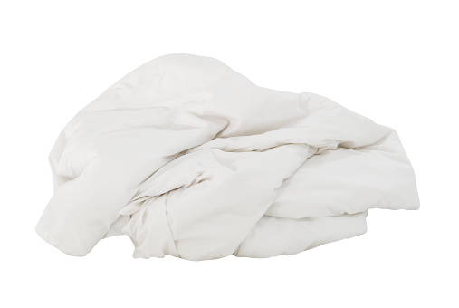 White crumpled blanket ball or bedclothes in hotel room leaved untidy and dirty after guest's use over night is isolated on white background with clipping path.