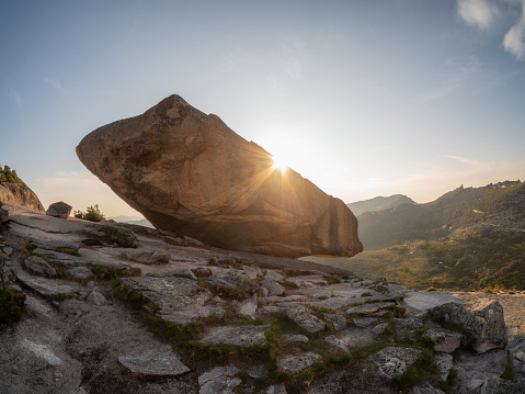 Giant balancing rock above the cliff. A natural geological phenomenon found at the Western Sayan. Natural Park Ergaki. Krasnoyarsk region. Russia.