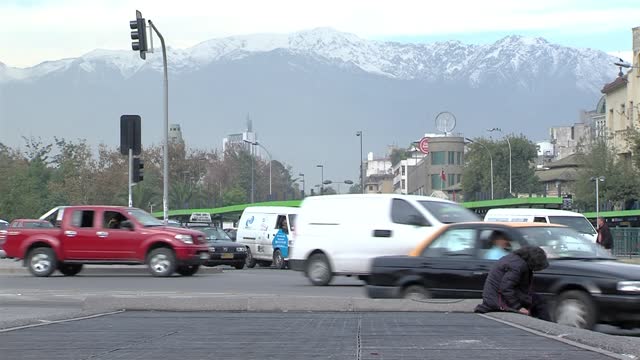 Busy Street with the Andes Mountain Range in the Background, Santiago de Chile, Chile.​