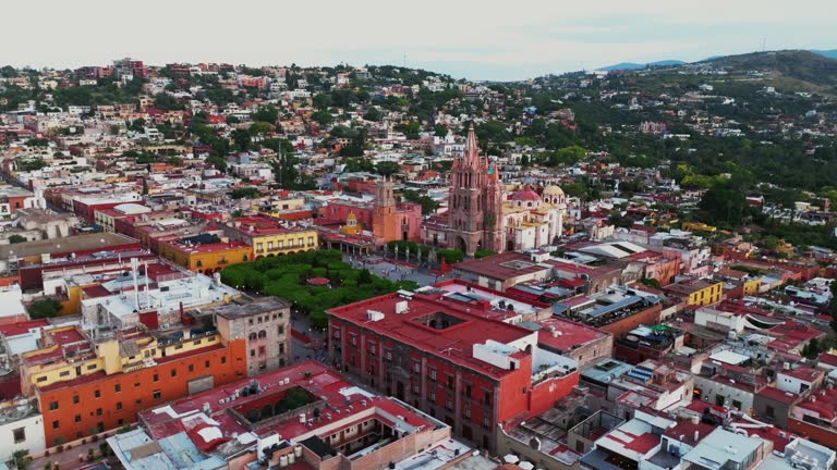 Daytime Aerial Orbit in San Miguel de Allende City Centre looking over El Campanario, Parroquia de San Miguel Arcangel and Jardin Allende