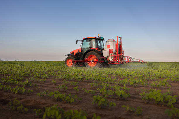 istock Tractor spraying soybean crops field 2088916730
