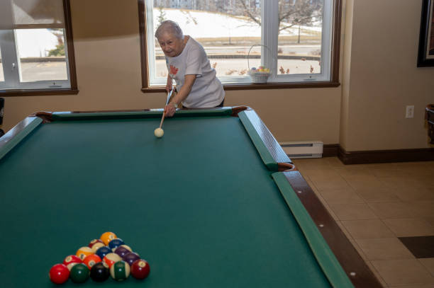 istock Senior woman playing pool 2088935537