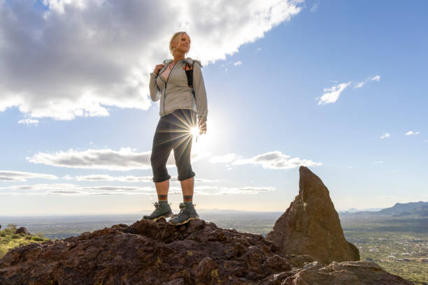 istock Hiker enjoys view from top of rock bluff 2088937091