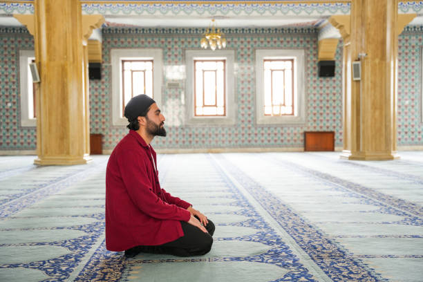 istock Muslim young man praying in the mosque 2088938009