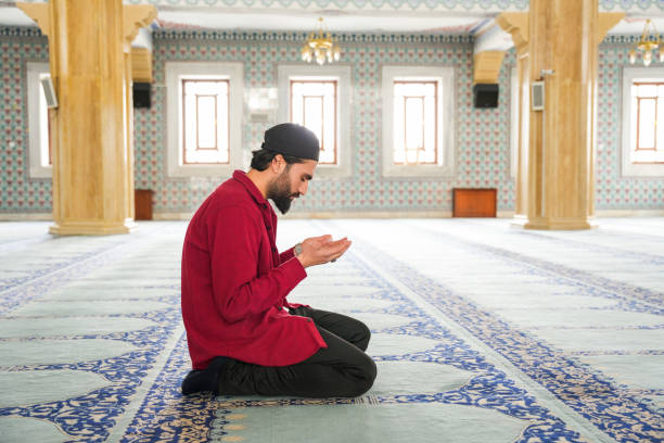 istock Muslim young man praying in the mosque 2088940806